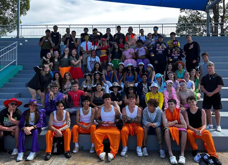 Students in grand stand at swimming carnival